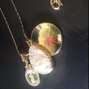 Long pendant with multiple charms
